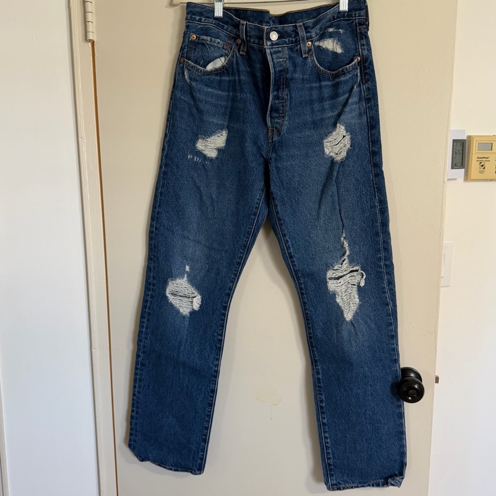 Lightly distressed dark wash Levi jeans